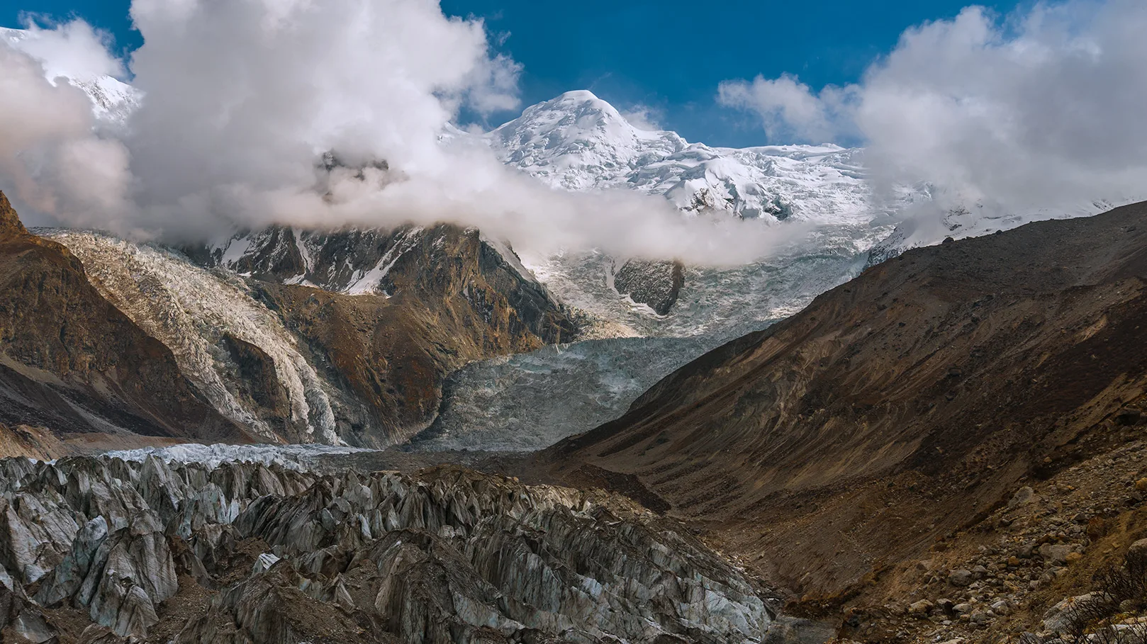 Rakhiot Glacier along the trek to the nanga parbat base camp and snow capped rakhiot peak at the background. Treks in Pakistan