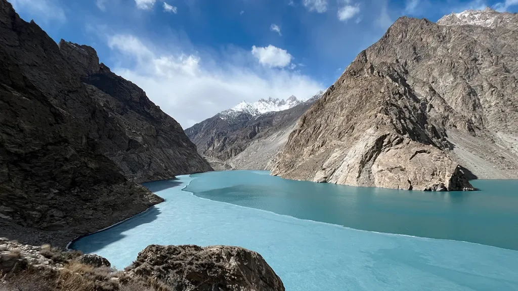 Half frozen Attabad Lake in Hunza during the spring blossom season in northern Pakistan