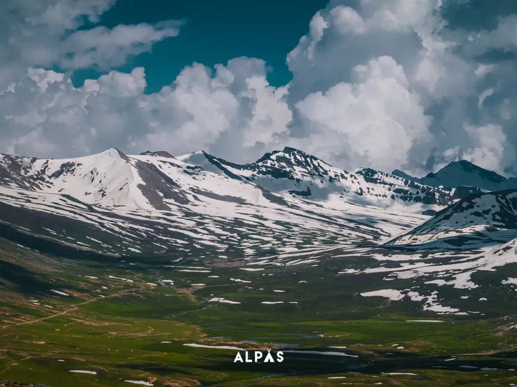 Meadows & Snow Covered Mountains in June as seen from Babusar Pass